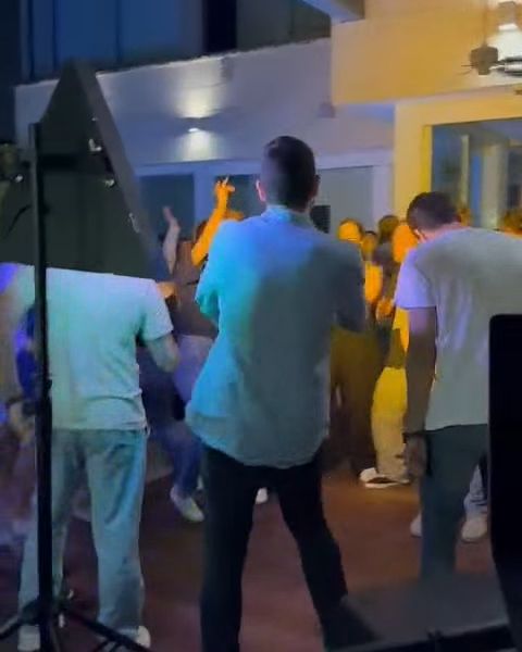 A dynamic video clip showing a professional DJ performing at a lively event.