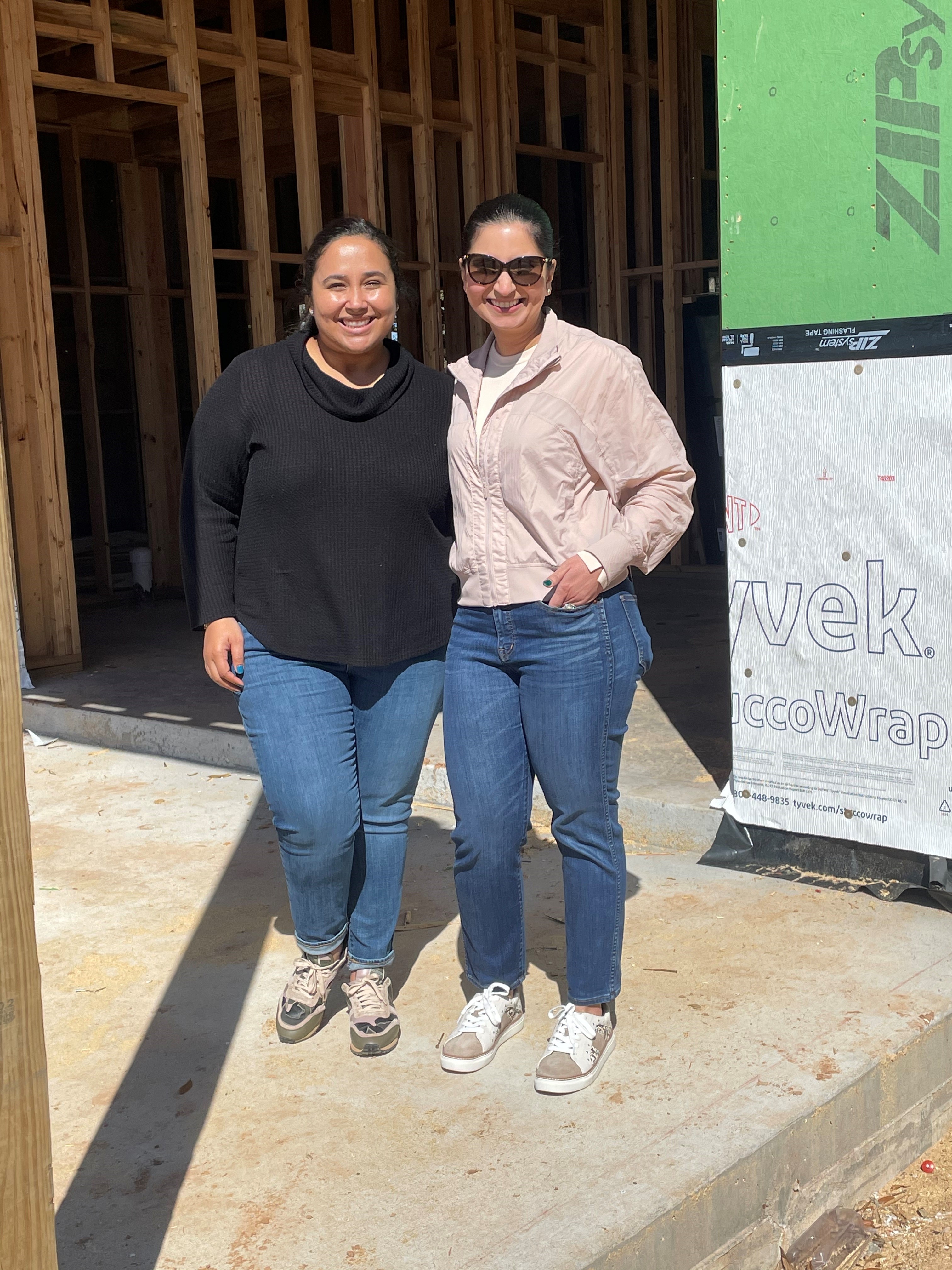 Patricia Sims - Home Building Consultant in Houston is pictured with leading interior designer Farrah Gandhi outside her custom-built home. 