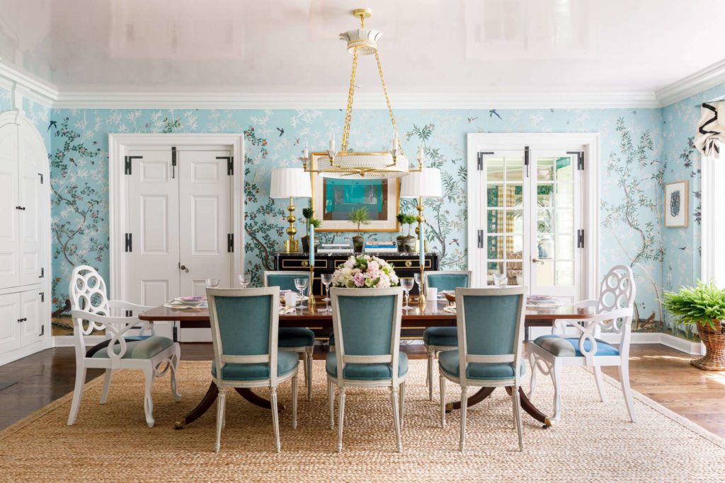 Well lit dining room with 7 chairs