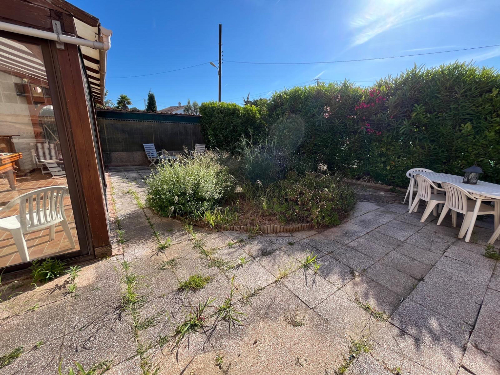 Unlandscaped garden with aging patio