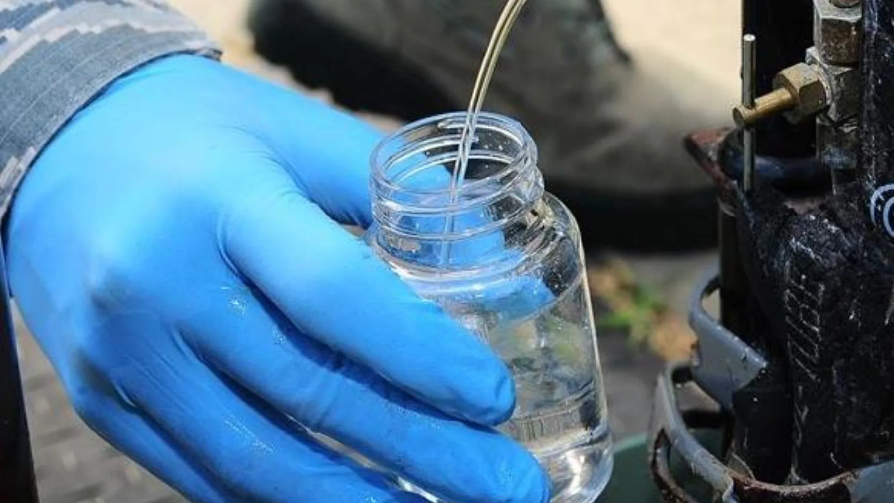 A laboratory technician analyzing drinking water samples for trace contaminants