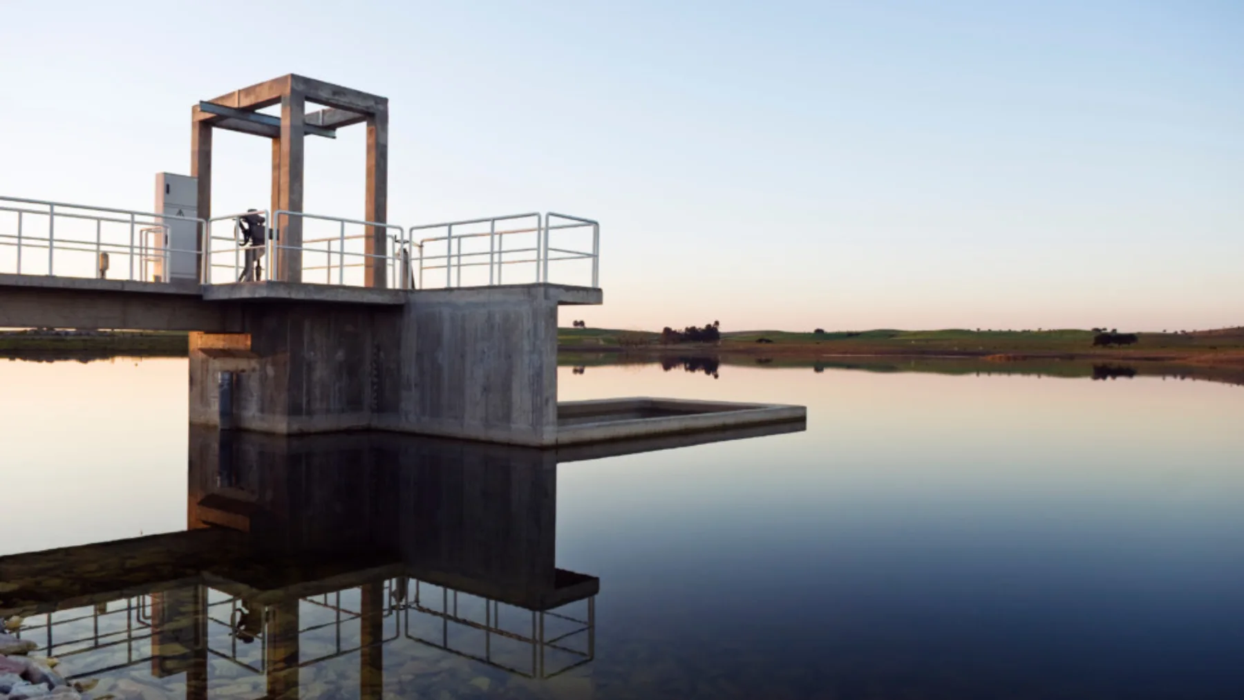 A government building reflected in water, representing the federal policy decisions that shape drinking-water quality