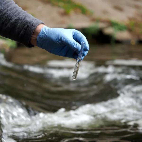 A water sample being collected for PFAS laboratory testing
