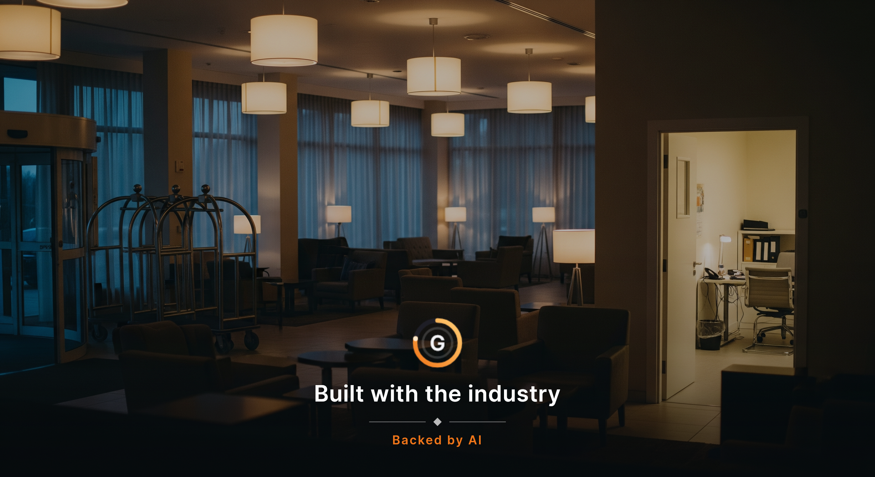 An empty hotel lobby just before evening arrivals, lamps on and luggage carts lined up, with one back-office door cracked open to a softly lit office beyond, chairs straight and the desk immaculate. The room feels ready, but the stillness hints at the staffing and handoff system beneath what guests