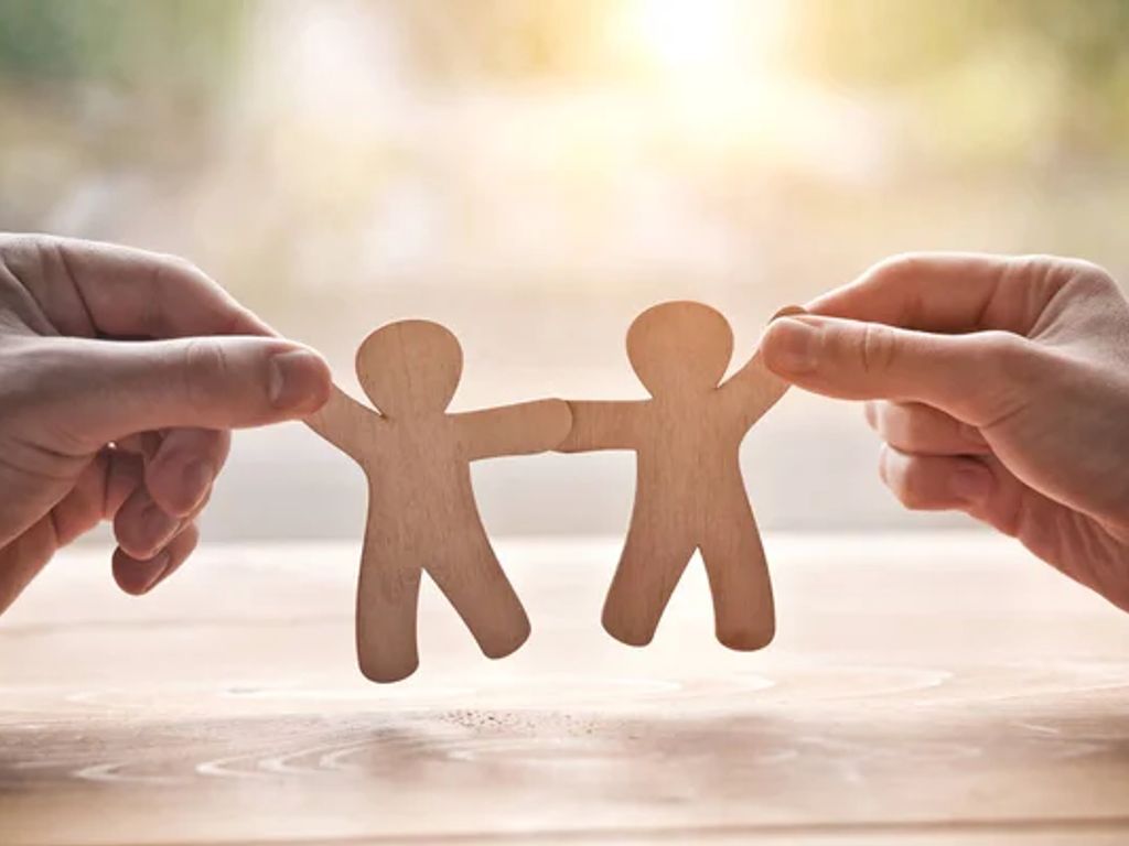 depositphotos_207351418-stock-photo-couple-holding-hands-wooden-toy.jpg