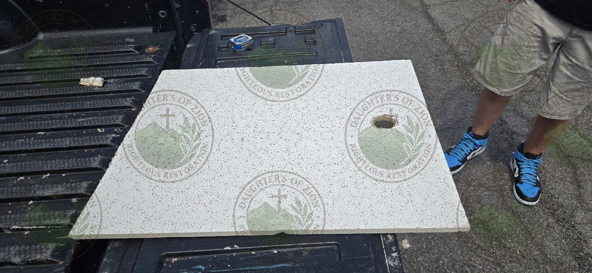 installing ceiling tiles — Eileen Moore
