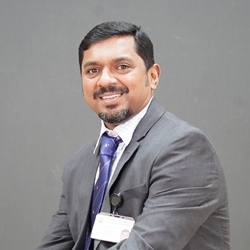 Headshot of Dr. Binu Kurien