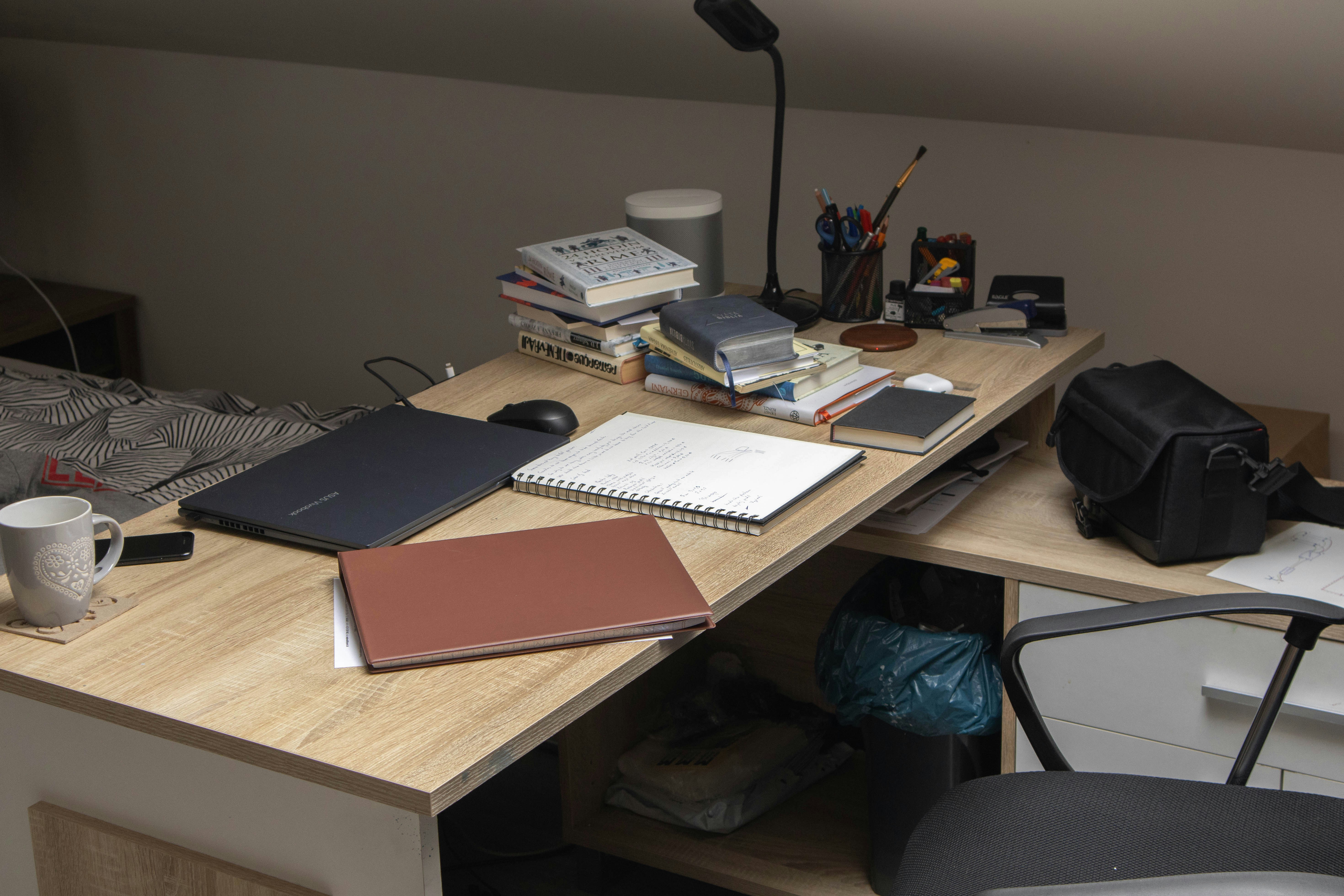 A background image showing a person writing medical notes.