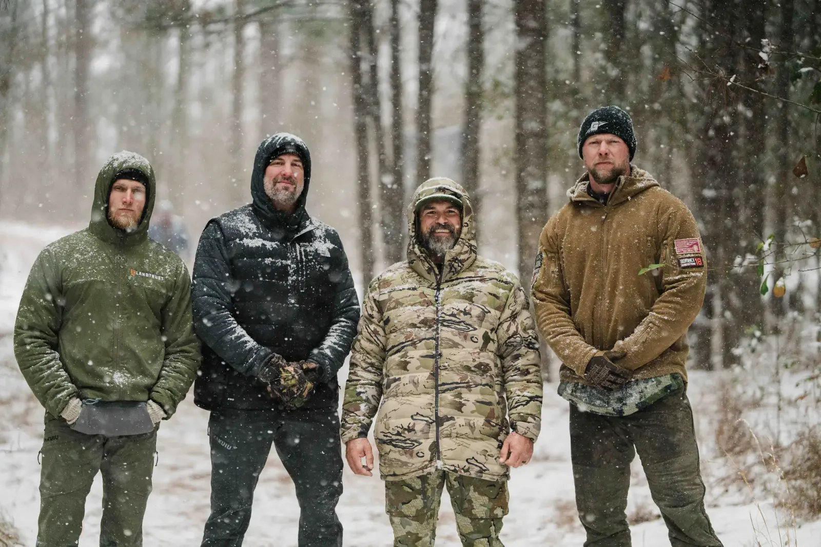 WorkBuilt coaches and athletes standing together in a snow-covered training environment