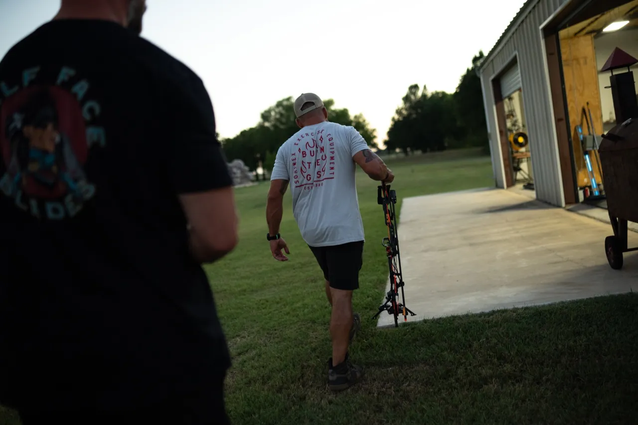 WorkBuilt athletes carrying training equipment from the gym into the field