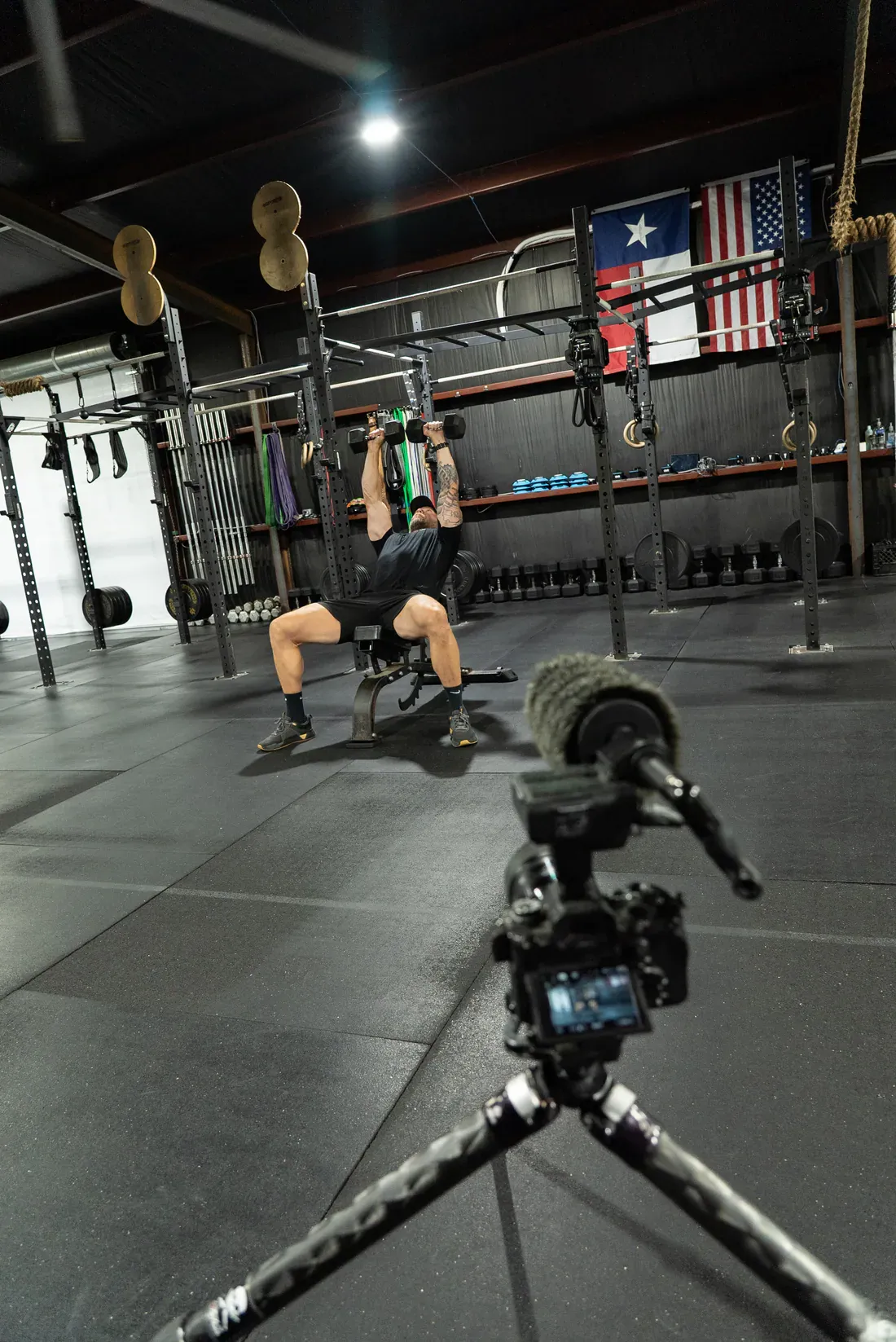 Athlete completing a dumbbell press during a WorkBuilt training session