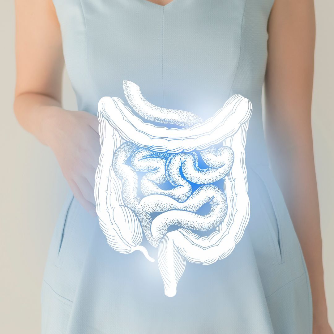  A woman in a blue dress holding a virtual intestinal tract in her hand