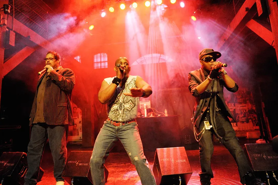 Sugar hill gang perform at a concert on stage