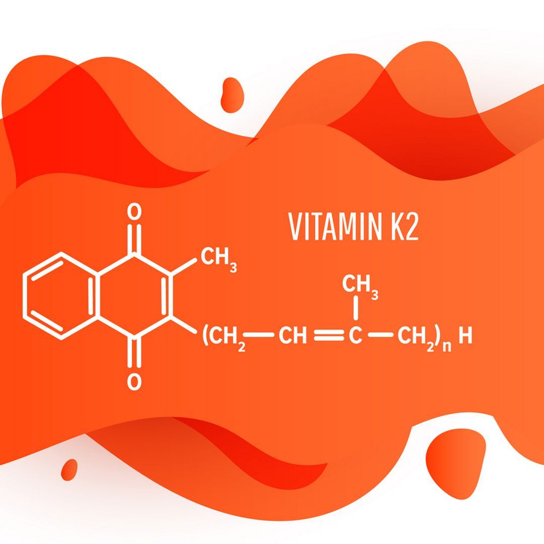Vitamin K2 structural chemical formula with an orange liquid fluid shape on white background.