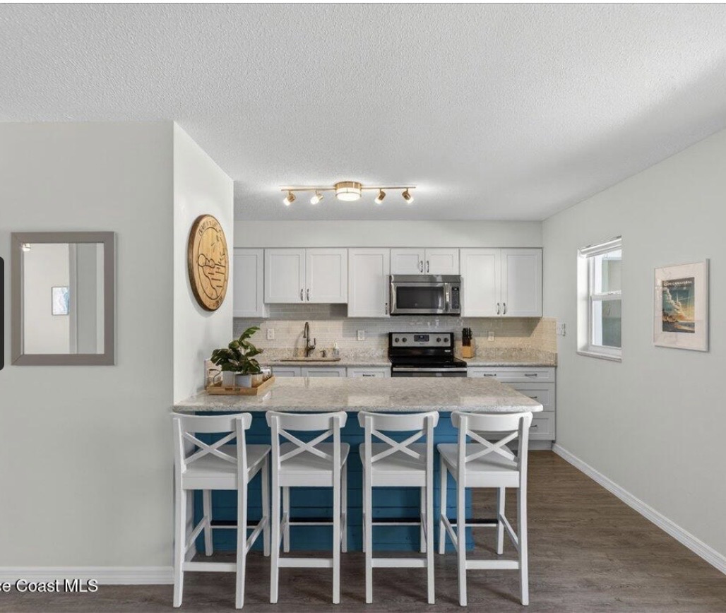 Rocket View and .3 mile walk to the beach. Pristine Fully Furnished 1bed/1bath Condo with pool