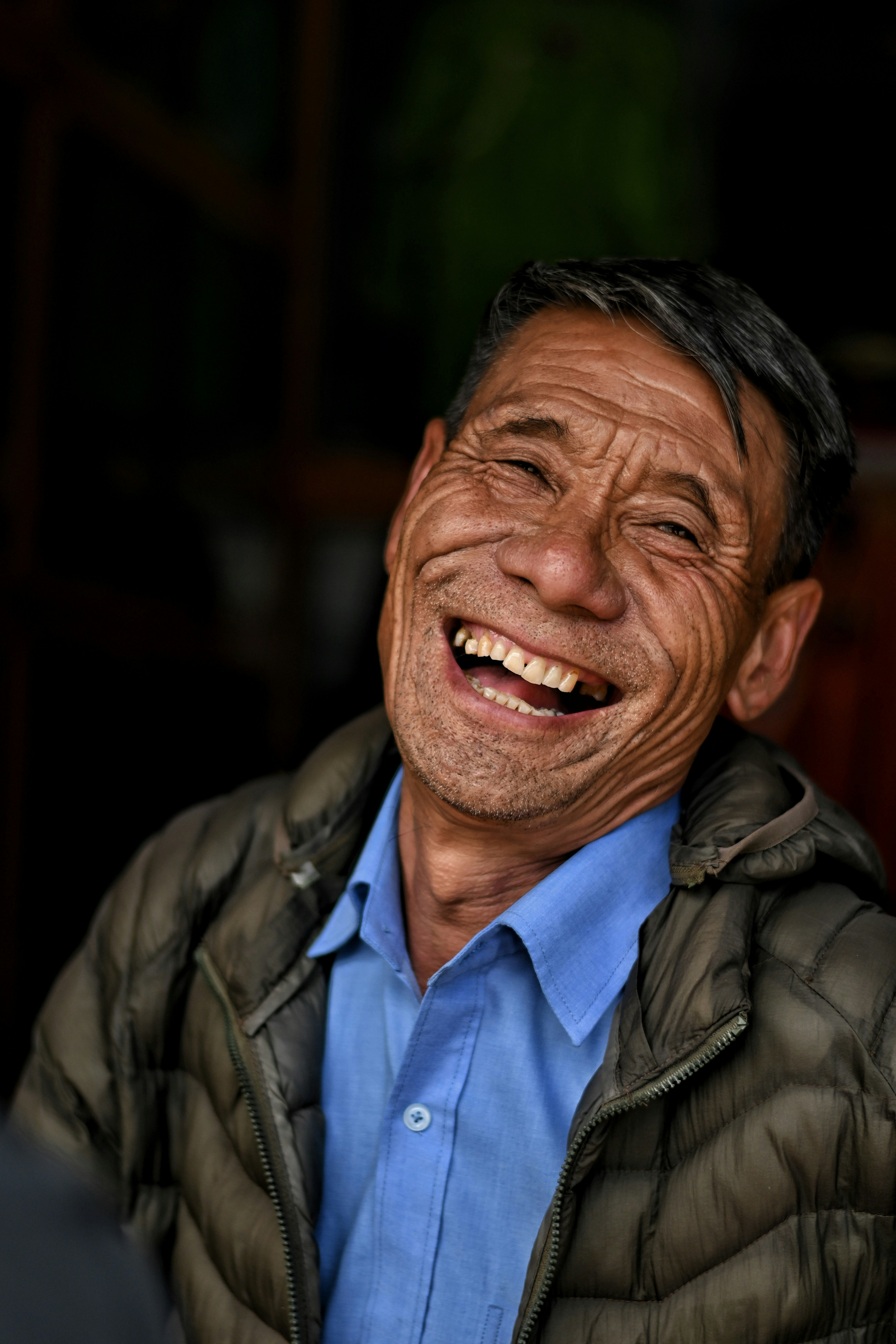 A smiling homestay owner in Darjeeling