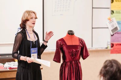 A Tiger Drama student presenting a costume design at a Thespian event
