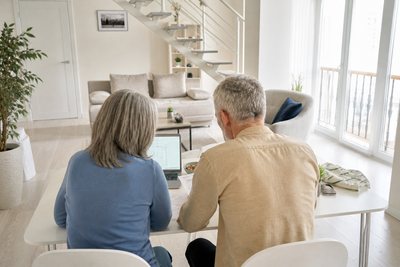 middle aged couple at desk