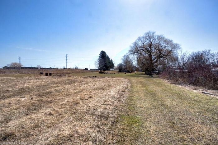 6.1 ACRE- M2 INDUSTRIAL LOT WITH 2 BED 1 BATH STOREY HOME
