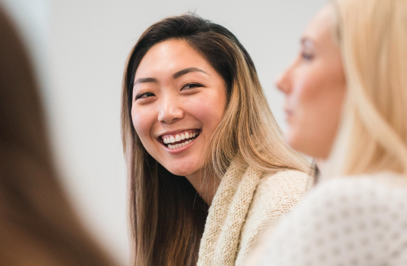 A photo of a woman smiling at the camera