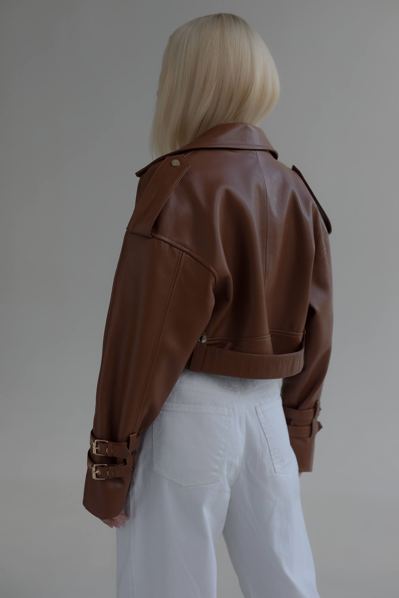 Jacket with two buckles on sleeves