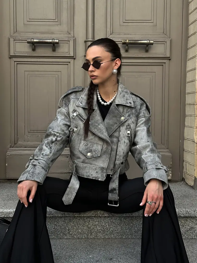 Jacket with two buckles on sleeves
