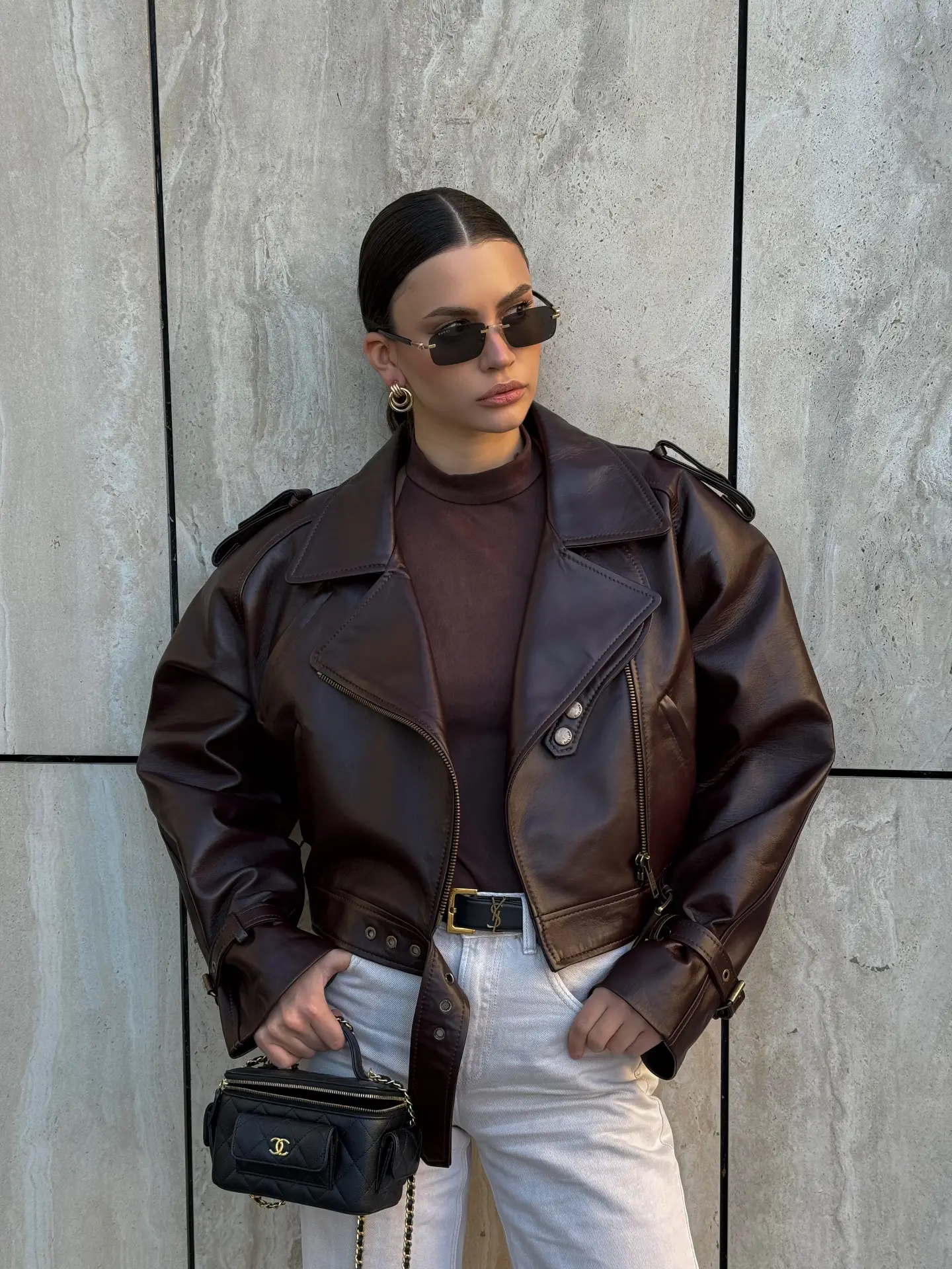 Short jacket with buckles on the sleeves