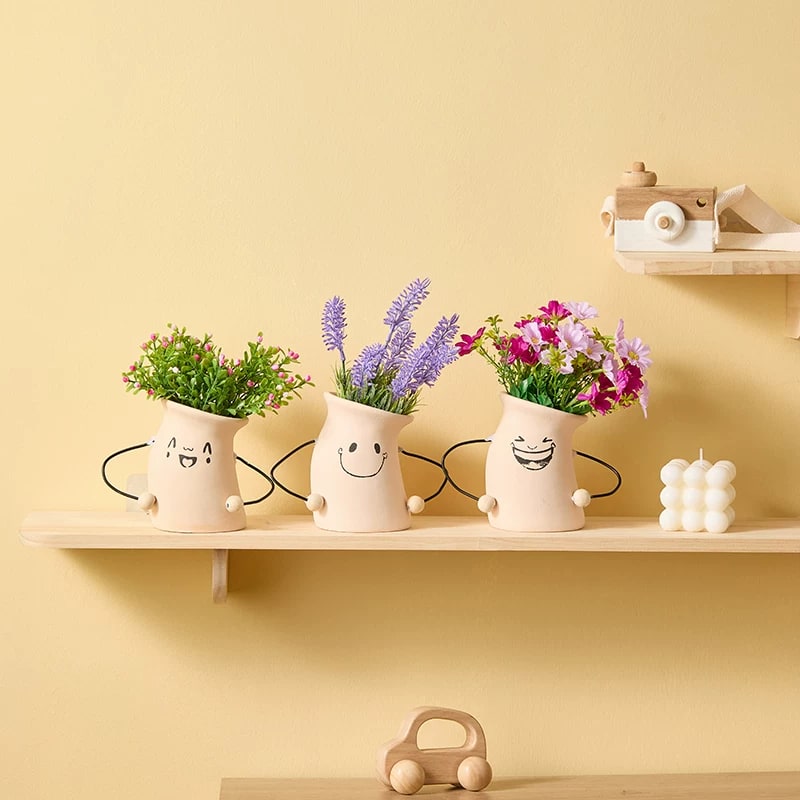 Ceramic Face Planter with Artificial Flower Arrangement photo 3