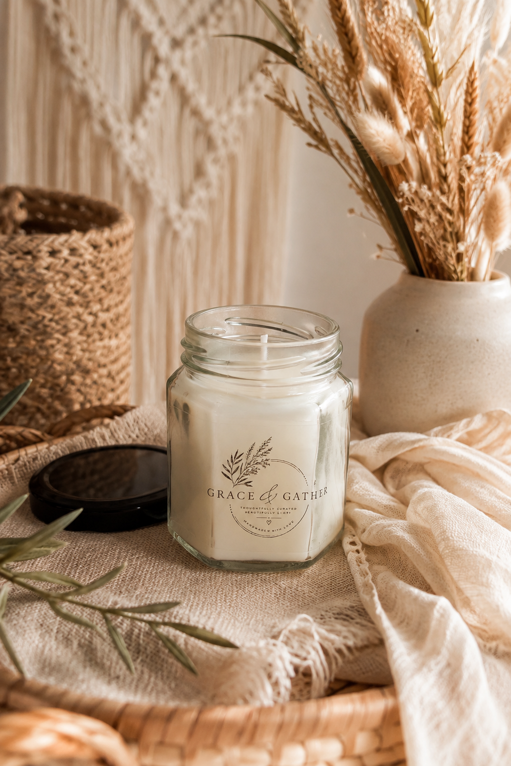 A lit candle in a glass vessel