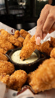 Iscas de Frango Empanado