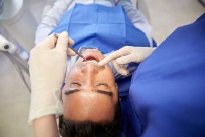 A man receiving an oral exam.