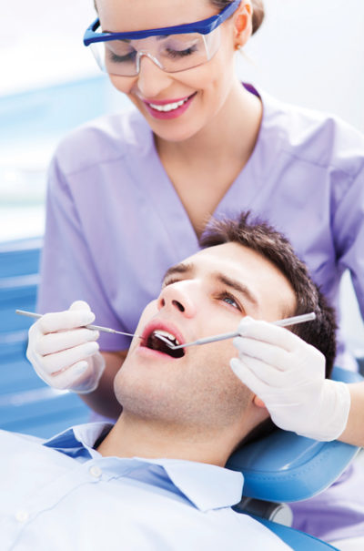 endodontist working on a patient