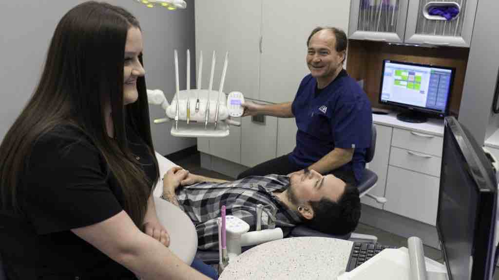 patient getting dental exam in Winnipeg