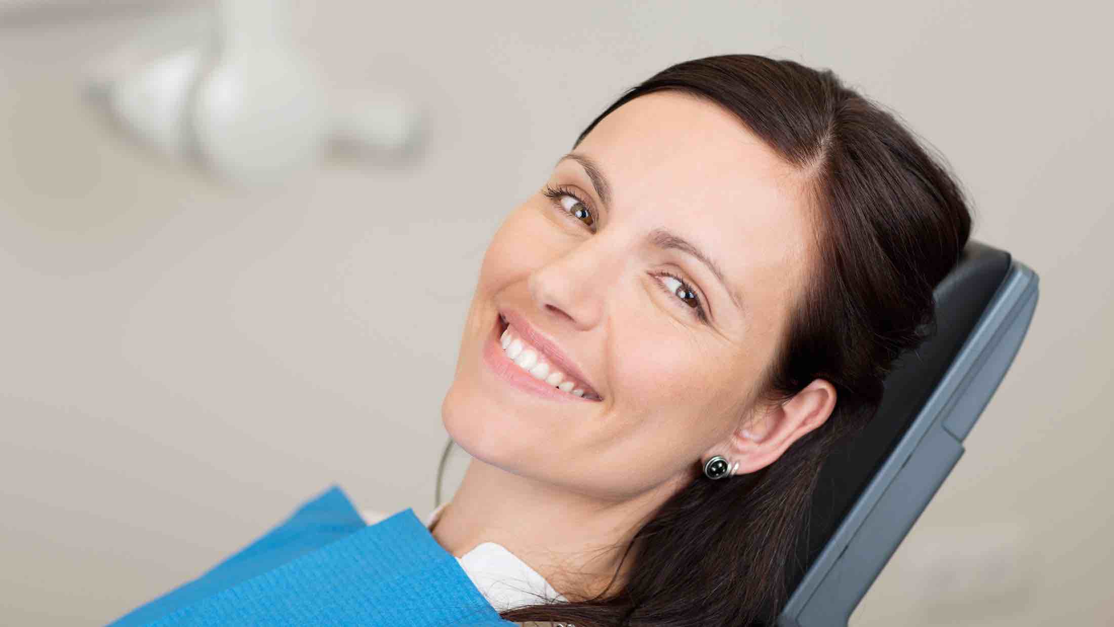 woman smile at Winnipeg dental exam