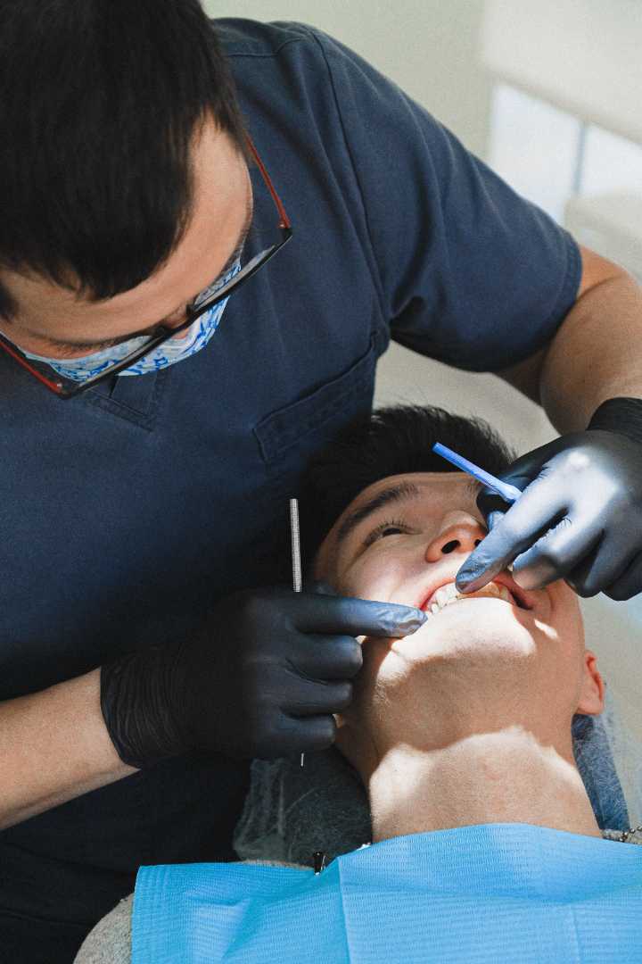 patient getting their teeth cleaned 