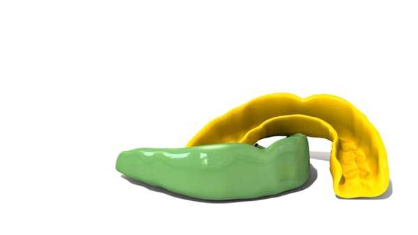 Sports Mouthguards in green and yellow.
