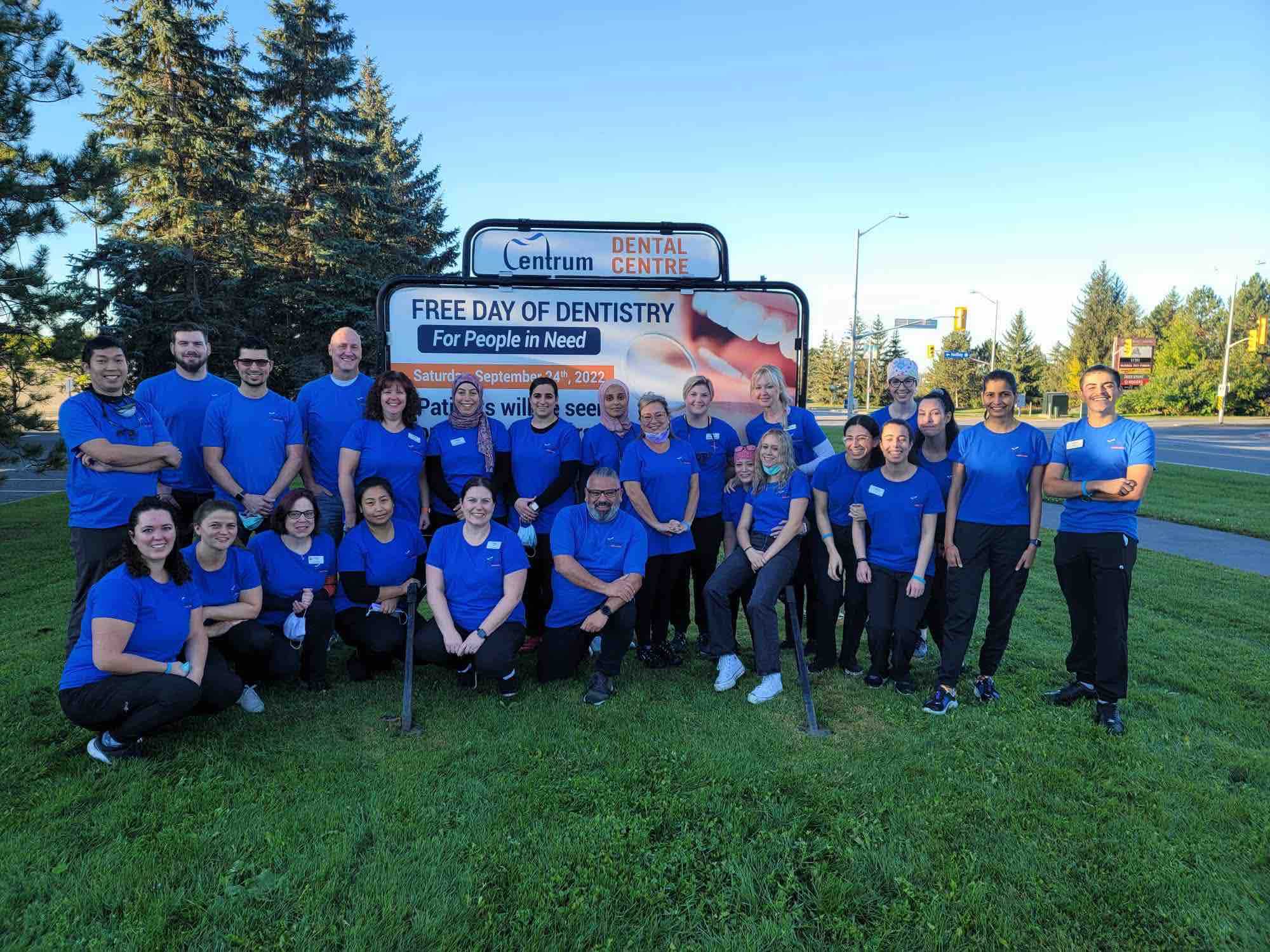 The Centrum Dental Team poses for a photo on the grass on Free Dentistry Day 2022