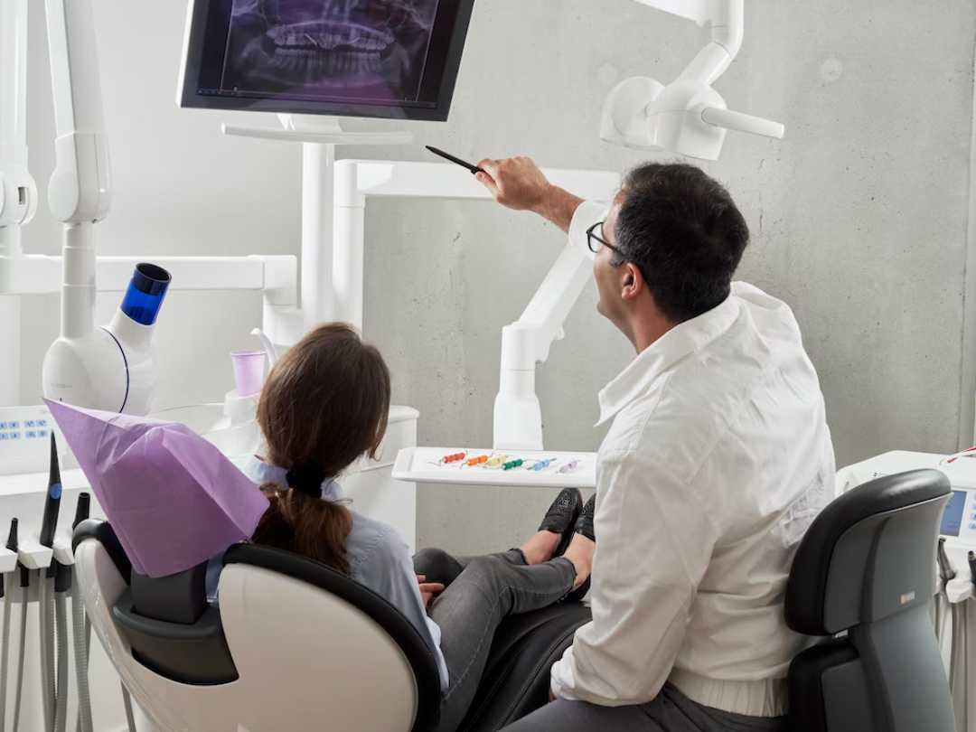 doctor showing a patient xrays