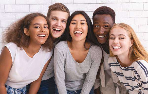 A group of young friends smiling together.