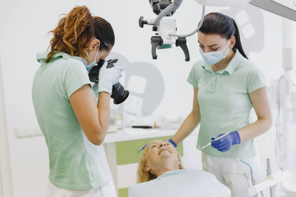 dentists taking pictures of a successful operation