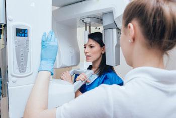 dentist using Digital X-ray on women patient 