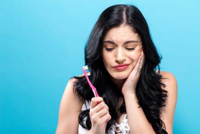 woman suffering from jaw pain