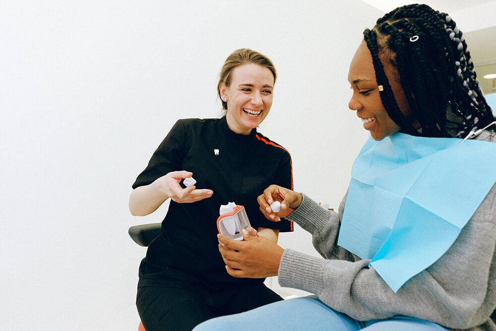 A dentist consulting with her patient.