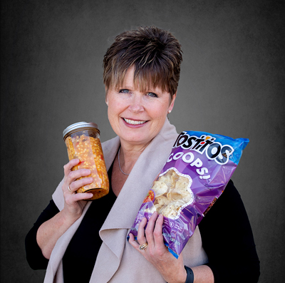 Dental Hygienist, Cori holding tostitos and salsa.