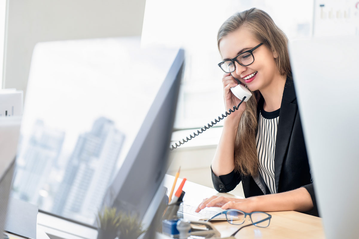 A receptionist on the phone.