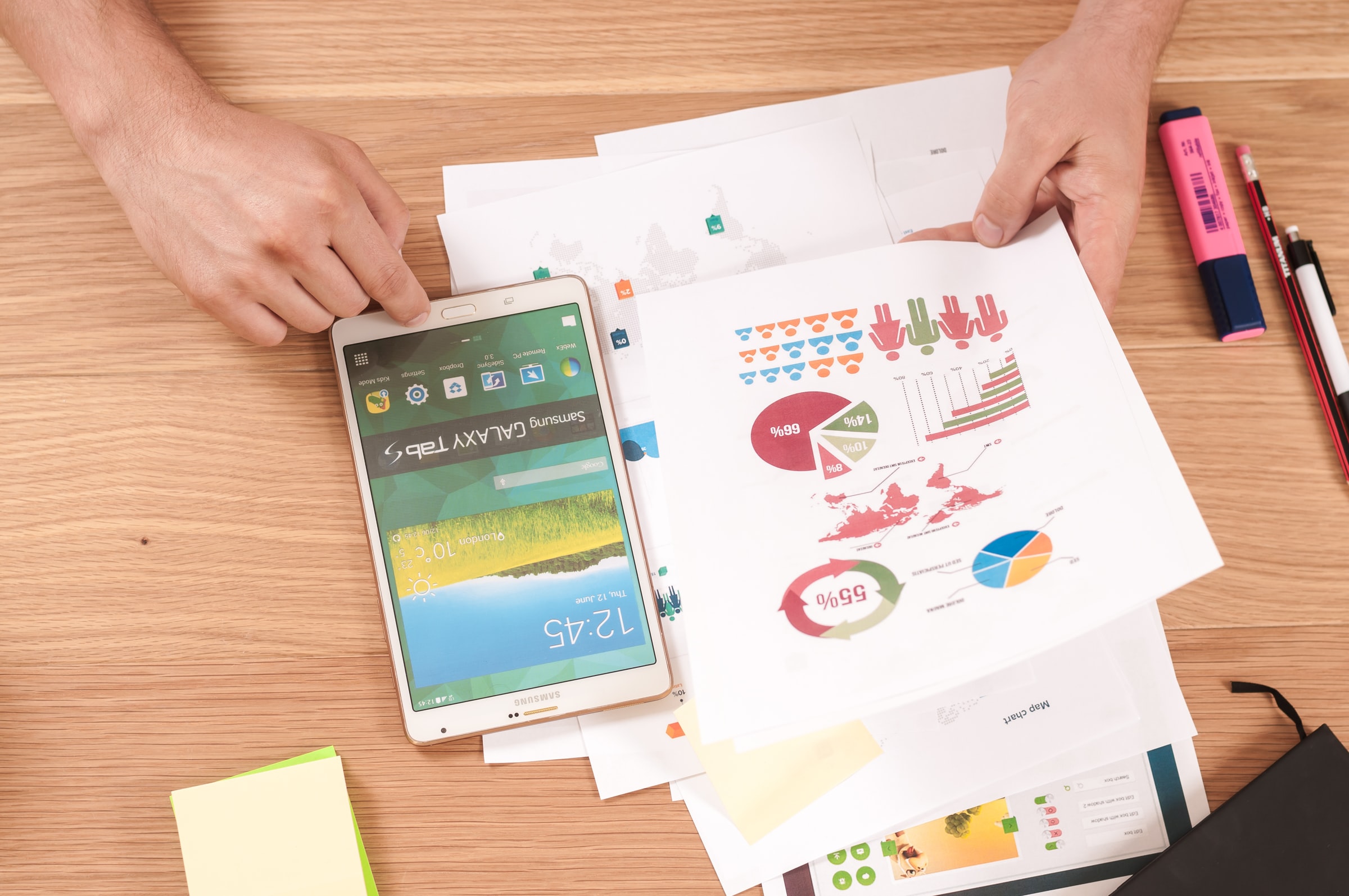 A person reviewing printouts of risk assessment data.