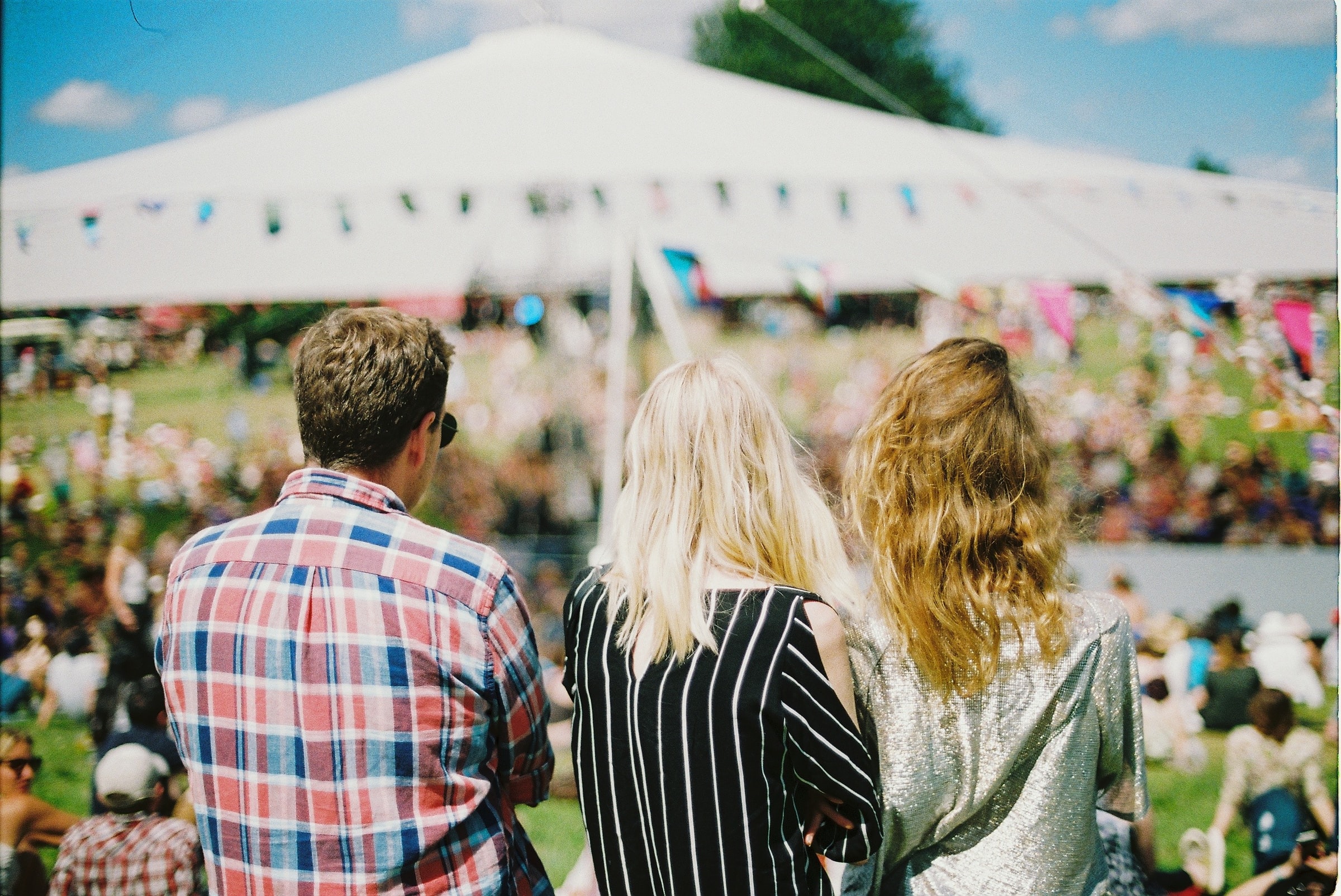 People at an outdoor music festival.