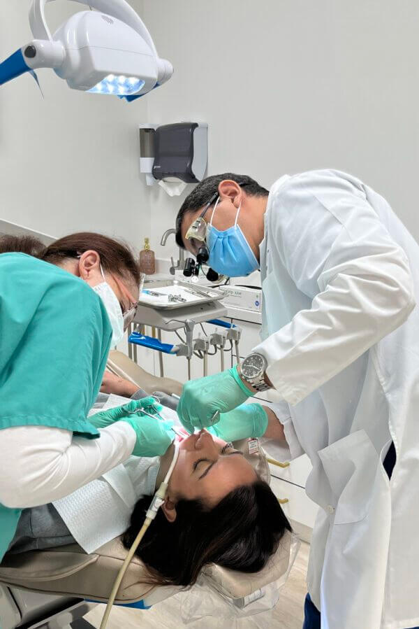 Dentist performing dental procedure