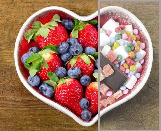 a heart shaped bowl showing the differences between healthy and unhealthy snacks