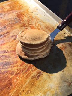 a stack of pancakes on the grill